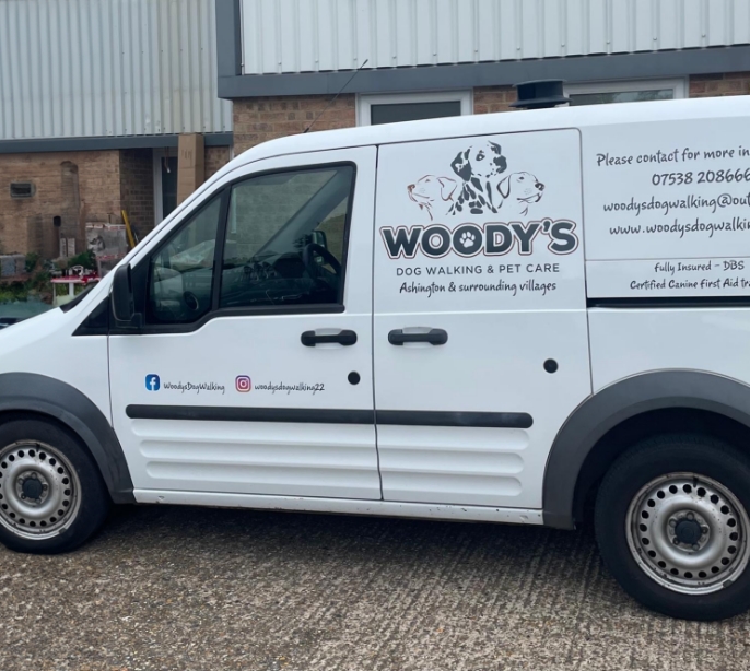 Woody's Dog Walking's custom-designed dog van